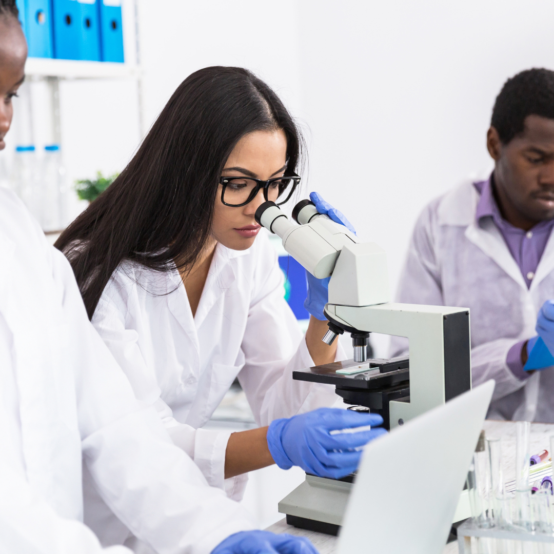 Microbiologist looking in a microscope